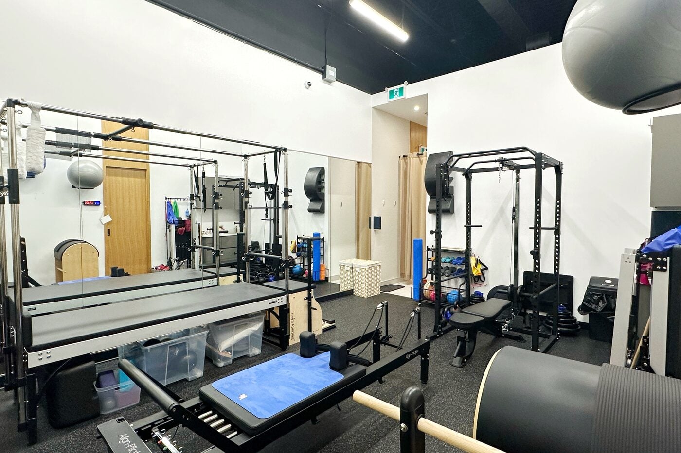 The Pilates studio at Aurora North Medical Centre, Aurora, with reformers, a tower and a Cadillac frame